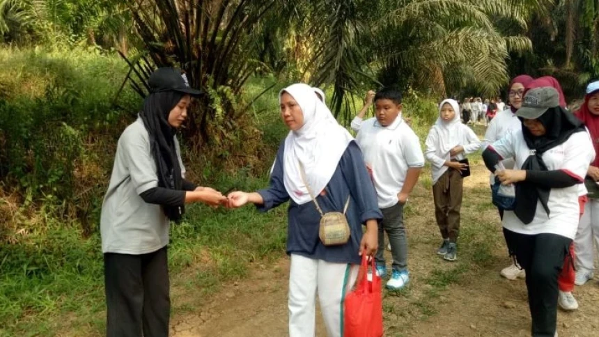 KKN Mahasiswa Unusia Bantu Pelaksanaan Jalan Sehat HUT RI di Kemang Bogor