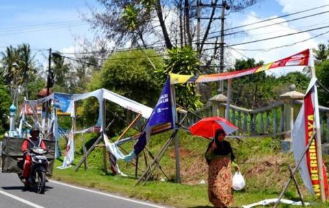 Hukum Merusak atau Menghilangkan Atribut Kampanye Lawan Politik