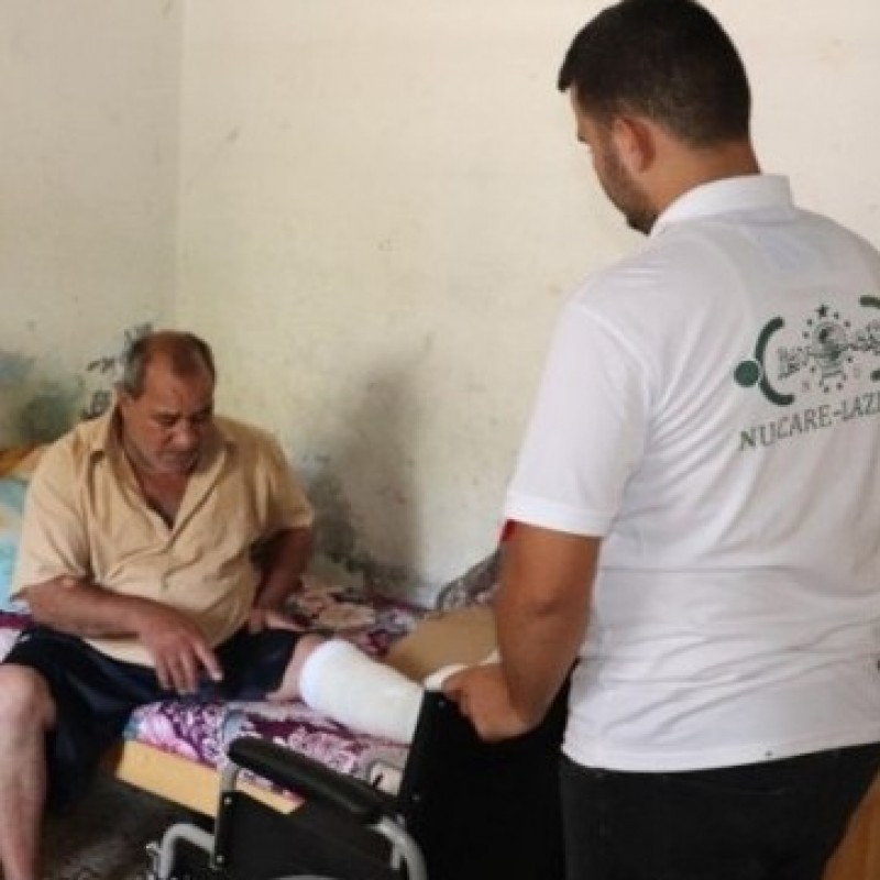 NU-Care LAZISNU distributes wheelchairs and crutches for Palestinian
